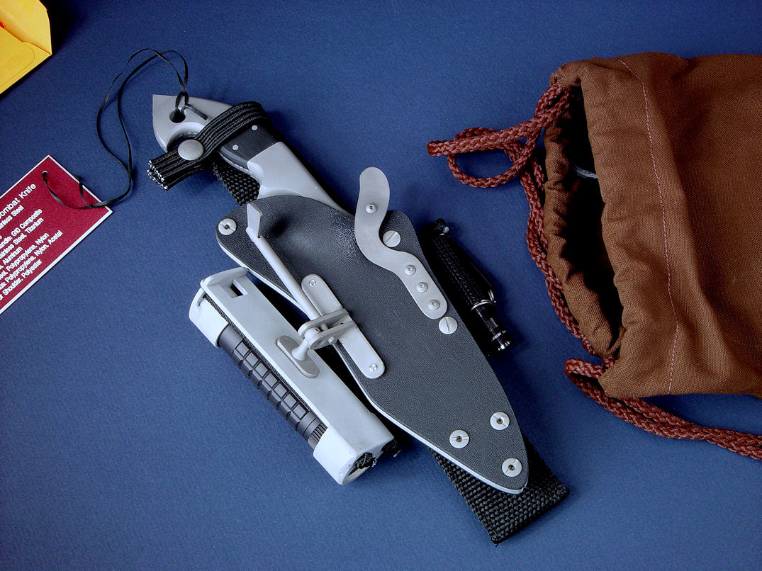 "Ari B'Lilah" Tactical Combat Counter-Terrorism Knife, obverse side view in ATS-34 high molybdenum stainless steel blade, 304 stainless steel bolsters, G10 composite handle, tension-locking sheath of kydex, aluminum, stainless steel, titanium, ultimate belt loop extender