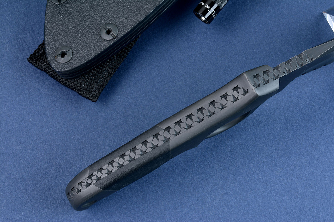 "Kairos" (Shadow Line), counterterrorism knife, spine view. Tang is fully tapered, thick and strong, bolsters are dovetailed to bed and lock handle scales to tang.