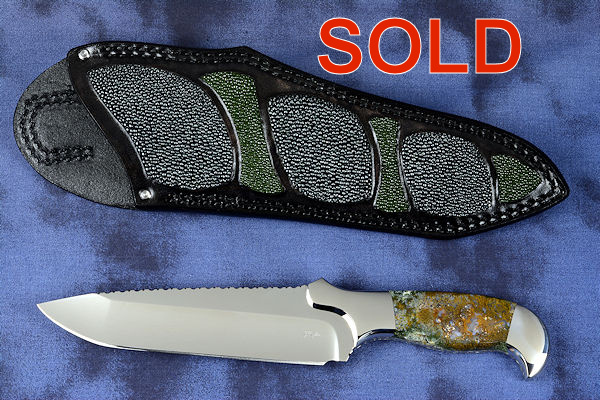 "Axia EL" fine handmade knife obverse side view  in T3 deep cryogenically treated CPM 154CM high mollybdenum powder metal technology martensitic stainless steel blade, 304 stainless steel bolsters, Linda Marie Moss Agate gemstone handle, hand-carved leather shoulder inlaid with green, black ray skin
