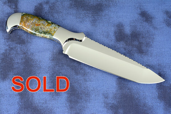 "Axia EL" fine handmade knife reverse side view  in T3 deep cryogenically treated CPM 154CM high mollybdenum powder metal technology martensitic stainless steel blade, 304 stainless steel bolsters, Linda Marie Moss Agate gemstone handle, hand-carved leather shoulder inlaid with green, black ray skin