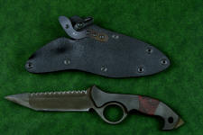 "Ari B'Lilah" counterterrorism, tactical, combat knife, obverse side view in T4 cryogenically treated 440C high chromium martensitic stainless steel blade, 304 stainless steel bolsters, red/black  G10 handle, hybrid tension tab locking sheath in kydex, anodized aluminum, anodized titanium, black oxide stainless steel