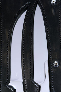"Bordeaux and Courbe" Professional grade chef's/BBQ knives, inside case detail in American Bison, heavy leather shoulder, stainless steel snaps, nylon stitching. 
