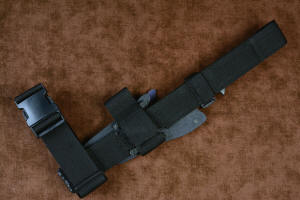 "Contego" Counterterrorism Tactical Knife, sheathed view, mounted to EXBLX, back side, in T3 cryogenically treated CPM154CM  powder metal technology high molybdenum martensitic stainless steel blade, 304 stainless steel bolsters, Black/Gray G10 fiberglass/epoxy composite handle, hybrid tension tab-locking sheath in kydex, anodized aluminum, stainless steel, titanium