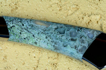 "Cygnus EL" 5 power enlargement without reflector above knife, obverse side handle view, in CPM 154CM powder metal technology high molybdenum martensitic stainless steel blade, T3 cryogenically treated, 304 stainless steel bolsters, Horse Canyon Plume Agate gemstone handle, hand-dyed  high strength silicone prise