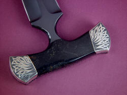 "Grim Reaper" reverse side handle detail. Nickel silver bolsters are hand-engraved in deep relief with winged pattern.