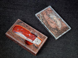 "Sadr" liner lock folding knife in snug case. Case is polished on the inside, has finger cuts to remove knife, and is lined with suede leather