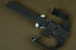 "Vindicator" tactical counterterrorism knife, back side view, black EXBLX, mounting details with thigh strap and buckles