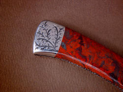 "Wasat" reverse side rear bolster engraving detail. Lines of stromatolite gemstone echoed in the curves of the light vine pattern of sthe engraving