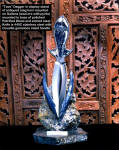 "Taos" on display stand of antiqued staghorn, gallena and pyrite ore, polished petrified agatized wood gemstone base